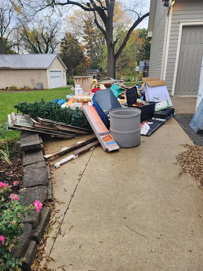 Dumpster being loaded with debris for Estate Cleanout Dumpster Rental in Summerset